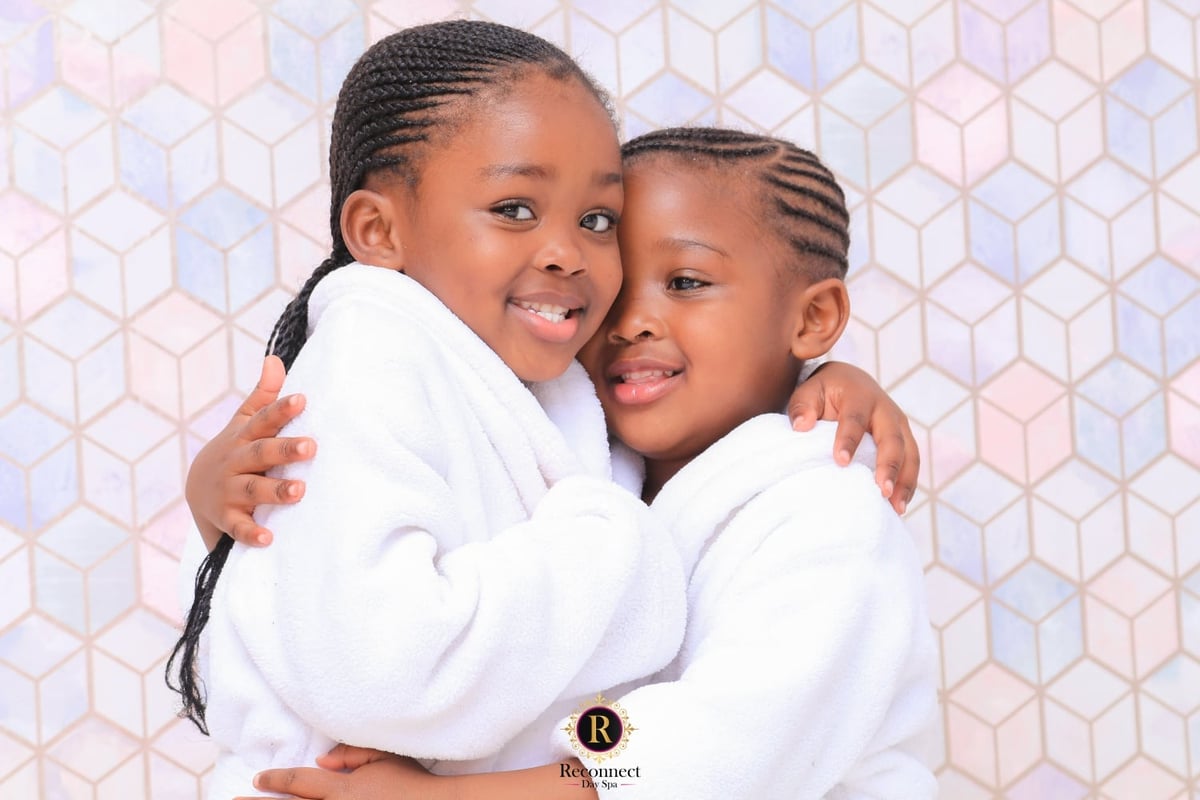 Two children in spa robes at a kids spa party