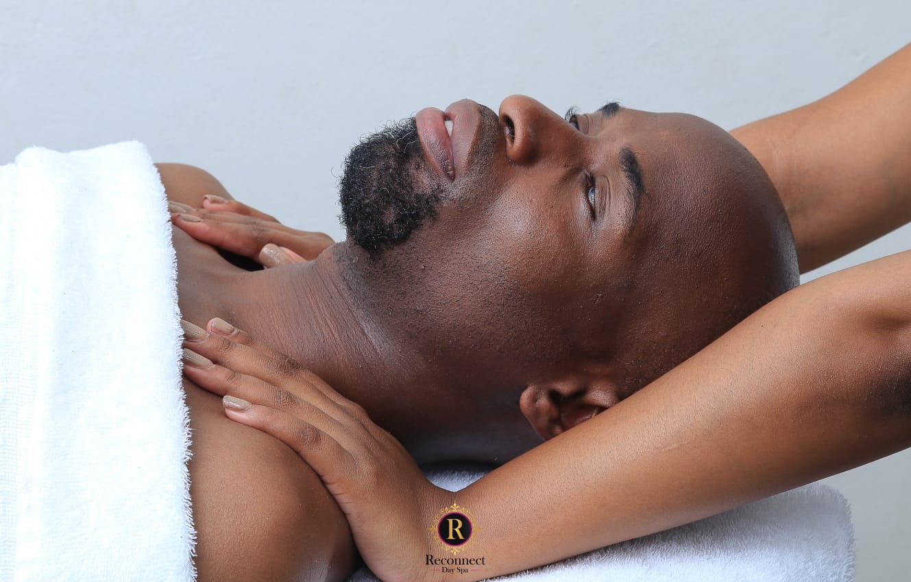 Man enjoying a neck and shoulder massage – CBD Infused Heated Balm Massage, Reconnect Day Spa