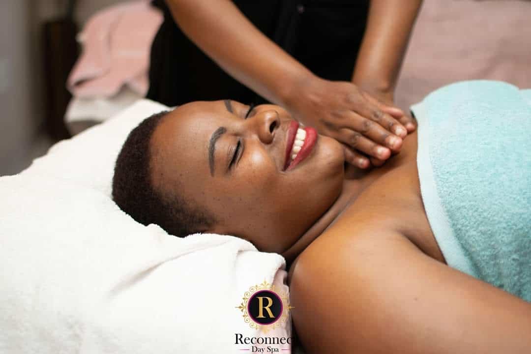 Woman enjoying a full body massage with her eyes closed – Full Body Massage, Reconnect Day Spa