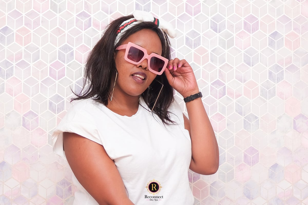 Young woman in a pink spa robe wearing playful pink sunglasses – Teen Big Spoil Spa Day for 1, Reconnect Day Spa