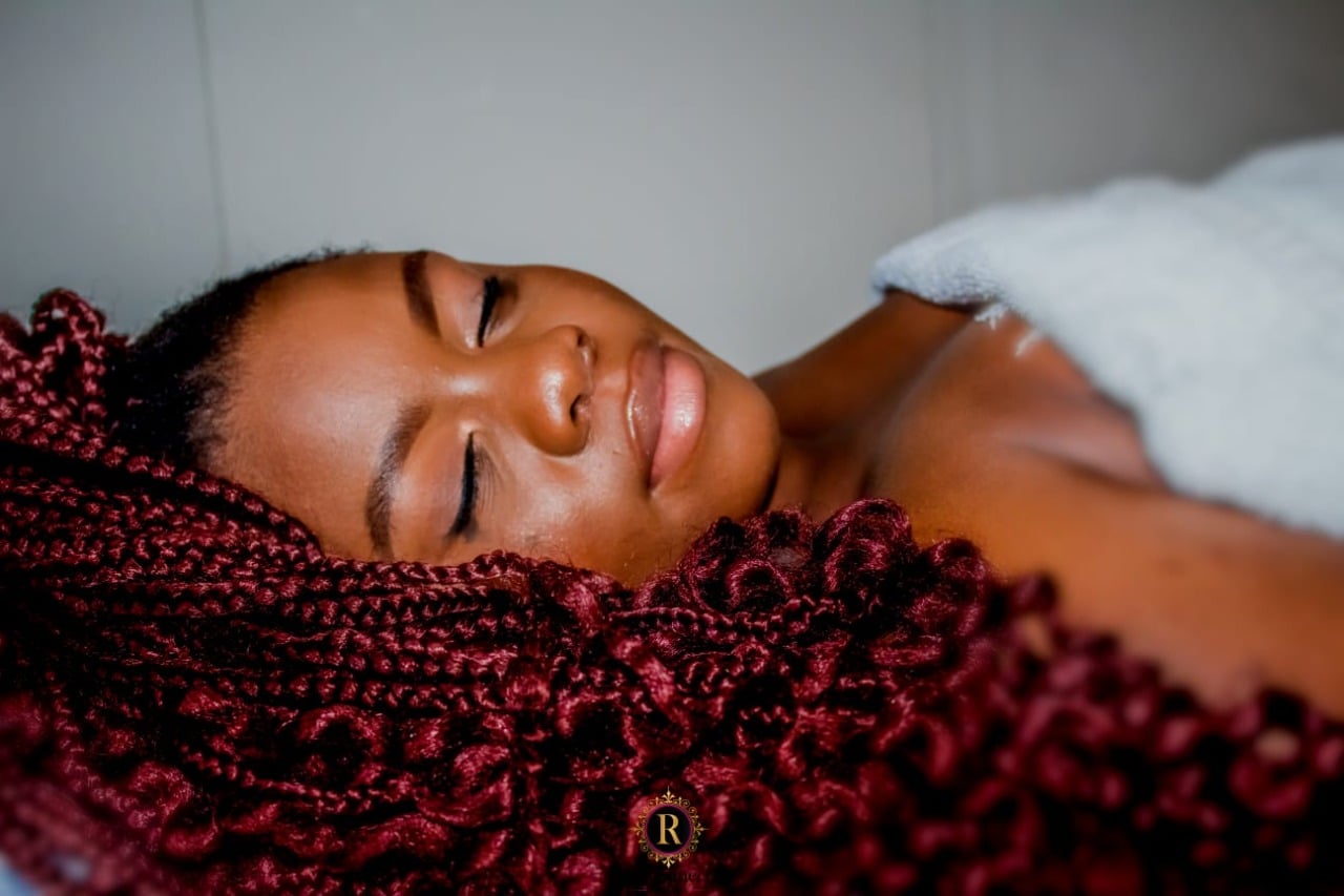 Woman with long braids relaxing during a massage – Weekend Pamper Spa Special for 1, Reconnect Day Spa